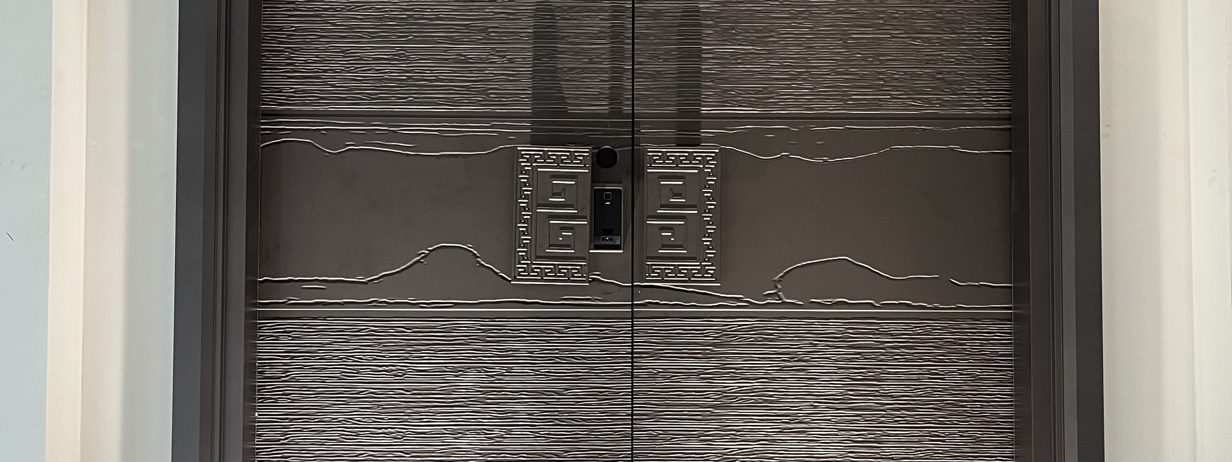 Large sliding door and window facade on a completed building