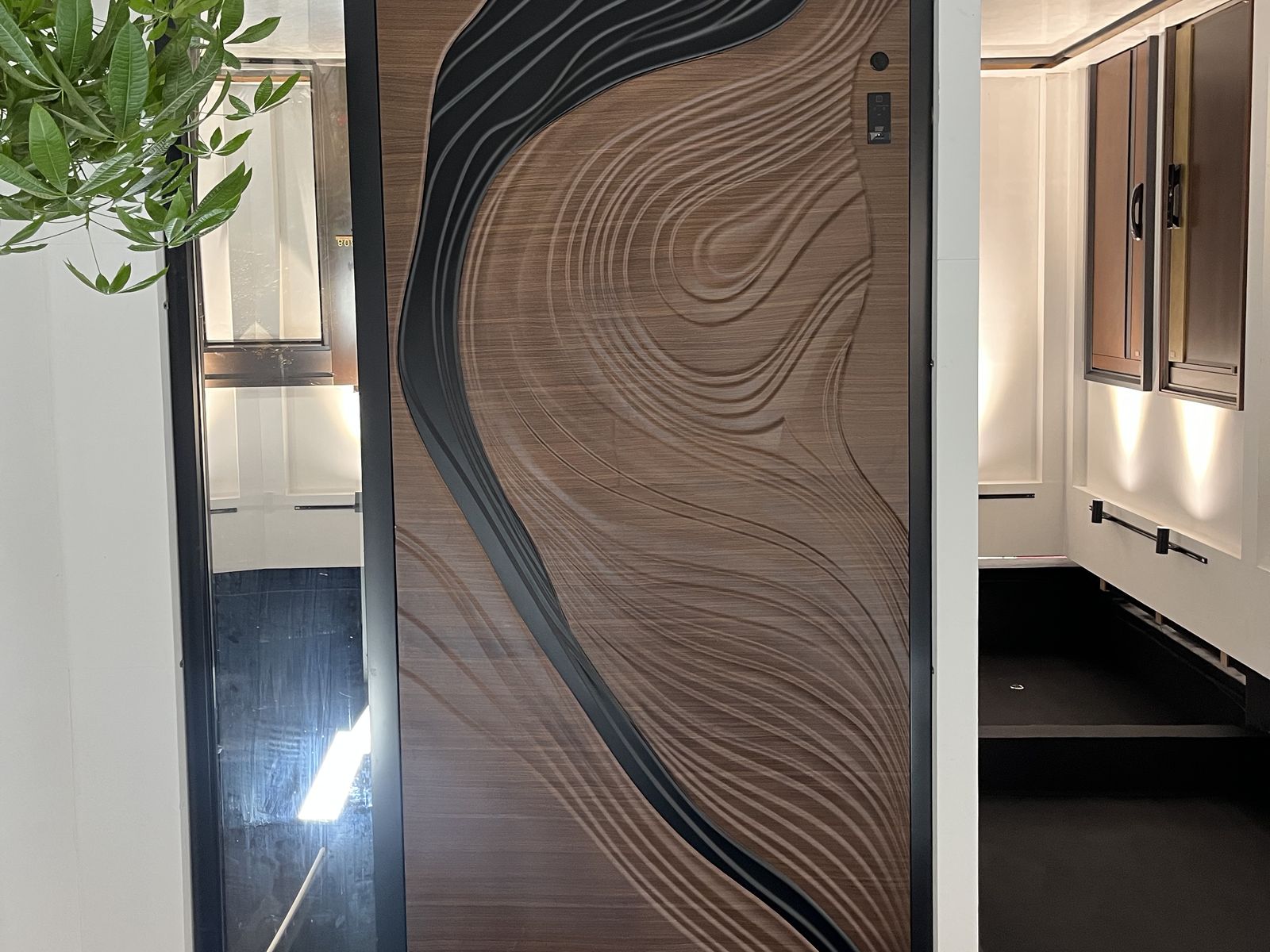 Showroom wide shot showing several door panels mounted on the wall